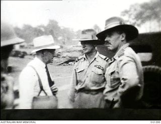 AITAPE, NORTH EAST NEW GUINEA. C. 1944-06. LEFT TO RIGHT: JOHN DEDMAN, THE MINISTER FOR WAR ORGANISATION OF INDUSTRY, ARTHUR DRAKEFORD, THE MINISTER FOR AIR, AIR COMMODORE F. R. W. SCHERGER, THE ..