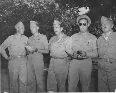 A Group of Men Pose for a Photograph at Camp Dealey