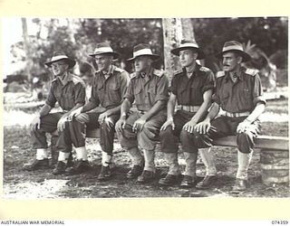 SIAR, NEW GUINEA. 1944-06-25. OFFICERS OF HEADQUARTERS, 57/60TH INFANTRY BATTALION. IDENTIFIED PERSONNEL ARE:- NX103304 CAPTAIN D.C.G. BRACKEN (1); VX81073 CAPTAIN R.M. MARTIN, ADJUTANT (2); ..