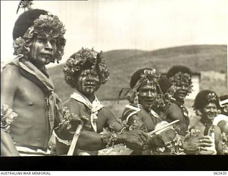 Kila Kila, New Guinea. 1943-12-25. Natives of the Mekeo tribe performing one of their traditional dances during the Christmas celebrations at the Australian and New Guinea Administration Unit ..