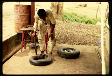 Repairing a puncture in Fiji, 1971