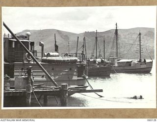 NAPA NAPA, NEW GUINEA. 1943-11-12. SHIPS AWAITING REPAIRS AT THE 1ST AUSTRALIAN WATERCRAFT WORKSHOPS, AUSTRALIAN ELECTRICAL AND MECHANICAL ENGINEERS