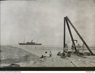 Fanning Island. September 1914. Staff of the Pacific Cable Board watching as the cable ship Iris carries out repairs to the damaged communications cable. Fanning Island was a small island south of ..