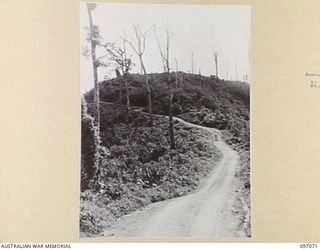 BOUGAINVILLE. 1945-09-26. THE ROAD LEADING TO THE TOP OF ARTILLERY HILL WHICH IS NOW OCCUPIED BY 3 DIVISION TROOPS. THE HILLS SHOWS SIGNS OF DEVASTATION FROM ALLIED ATTACKS