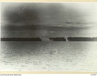 PURIATA RIVER, BOUGAINVILLE ISLAND. 1944-12-31. SMOKE BOMBS, DROPPED BY RAAF "BOOMERANG" AIRCRAFT BURSTING ON JAPANESE POSITIONS TO GIVE A "SIGHTER" TO THE ALLIED NAVAL FORCES BOMBARDING THE ENEMY ..