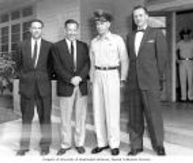 Senator Henry M. Jackson with Major General Gary Smith of the Pacific Air Force and Colonel Douglas B. Gordon in front of a building at Hickam Air Force Base, Hawaii, 1955