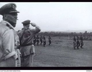 VUNAKANAU, NEW BRITAIN, 1946-02-12. FIRST FULL REGIMENTAL PARADE OF THE PACIFIC ISLANDS REGIMENT AS ONE COMPLETE UNIT. UNTIL THE WAR ENDED COMPANIES AND PLATOONS SERVED IN MANY DIFFERENT AREAS. ..