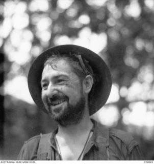 PAPUA, NEW GUINEA. 1942-10. A HAPPY AND BEARDED AUSTRALIAN SOLDIER IN NEW GUINEA PRIVATE A. ALDERSON OF THE 2/33RD AUSTRALIAN INFANTRY BATTALION