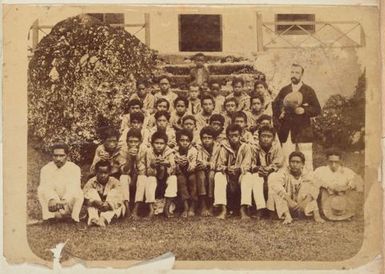 Group of boys and Reverend J.J.K. Hutchin. From the album: Cook Islands