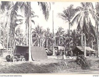 NORTH ALEXISHAFEN, NEW GUINEA. 1944-09-14. A SECTION OF THE CAMP AREA OF THE 133RD BRIGADE ORDNANCE FIELD PARK. IDENTIFIED PERSONNEL ARE: NX110628 CORPORAL A.D. LAWRENCE (1); NX110624 STAFF ..