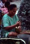 Grating ingredients for vaihu tamoko for fakanoanoa (evening mourning gathering)