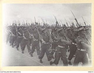 WEWAK AIRSTRIP, NEW GUINEA. 1945-09-03. A CLOSE-UP OF TROOPS OF 2/11 INFANTRY BATTALION DURING THE MARCH PAST AT A BRIGADE PARADE OF 19 INFANTRY BRIGADE. THE PURPOSE OF THE PARADE WAS TO ..