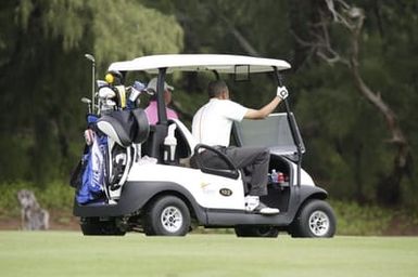 Barack Obama plays golf with Prime Minister Najib Razak, Joe Paulsen, and Mike Brush in Kaneohe Bay, Hawaii, December 24, 2014