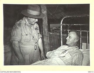 AITAPE, NEW GUINEA. 1945-03-20. GENERAL SIR THOMAS A. BLAMEY, COMMANDER-IN-CHIEF, ALLIED LAND FORCES, SOUTH WEST PACIFIC AREA (1), TALKING TO PRIVATE L.R. SHRIVES, 2/3 INFANTRY BATTALION (2), WHILE ..