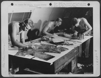 Men Of The 3Rd Photo Reconnaissance Squadron Lab Lay Out A Mosaic Of Tokyo, Japan. The Sections Of The Mosaic Were Taken By T/Sgt. Walter C. Marvin On The First Photo Reconnaissance Mission Over Japan On 1 November 1944. Saipan, Maianas Islands. (U.S. Air Force Number 64241AC)