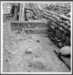 Trench behind ahu of coastal marae site 129 looking from E-W corner stone at lower right. Detail showing layers of fill