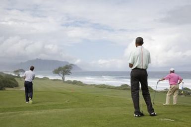 Barack Obama plays golf with Prime Minister Najib Razak, Joe Paulsen, and Mike Brush in Kaneohe Bay, Hawaii, December 24, 2014