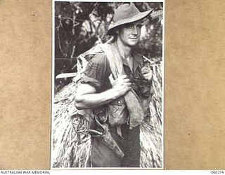 GUY'S POST, FARIA RIVER AREA, NEW GUINEA. 1943-11-08. VX119291 SERGEANT M. TRASK OF BACCHUS MARSH, VIC AND OF THE 2/33RD AUSTRALIAN INFANTRY BATTALION MOVING TO GUY'S POST TO RELIEVE MEMBERS OF THE ..