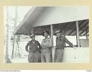 NEW GUINEA. 1944-05-01. MEMBERS OF THE MILITARY HISTORY SECTION. IDENTIFIED PERSONNEL ARE:- NX58247 SERGEANT A. L. FRAZER (1); NX111341 SERGEANT A. RAFTY (2); VX93433 CAPTAIN W. H. DARGIE (3)