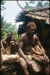 Men in front of house