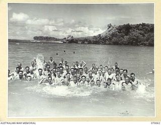 SIO, WEST NEW GUINEA. 1944-01-24. MEN OF THE 4TH INFANTRY BATTALION TAKING ADVANTAGE OF A GOOD BEACH NEAR SIO MISSION. GOOD BATHING IS POSSIBLE AT VARIOUS BEACHES ON THE COAST