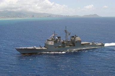 Portside view of the US Navy (USN) Ticonderoga Class Guided Missile Cruiser USS VINCENNES (CG 49) approaching Pearl Harbor, Hawaii (HI), for a scheduled port visit. This is the ship's last port call before being decommissioned at San Diego, California (CA)