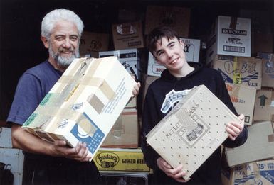 Books for Fiji; book repair specialist Bill Tito and Upper Hutt College student Tim Laird.