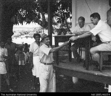 Indian and Fijian mill workers being paid by CSR officers