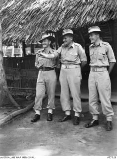 DOBODURA, NEW GUINEA. 1943-10-11. OFFICERS OF THE 11TH AUSTRALIAN DIVISION. LEFT TO RIGHT:- NX100046 MAJOR (MAJ) K. G. BAILEY, DEPUTY ADJUTANT AND QUARTERMASTER GENERAL (LEFT); NX100054 COLONEL J. ..