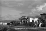 Guam, men and cars near 'Pan American World Airways' offices