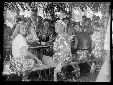 Welcoming reception in Tahiti showing Sir Leonard Isitt with guests dining