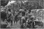 Dispute in Tuguma: men discuss garden damage done by a neighboring group's pig