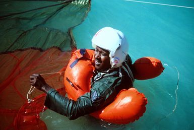 SSGT Willie Dale, a photographer assigned to Detachment 3, 1269th Audiovisual Squadron, participates in a water survival training exercise