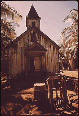 OLD CHURCH IN KEOMUKU, A "GHOST TOWN" ON THE ISLAND'S EAST SHORE, WHERE DEVELOPERS PLAN TO BUILD A HOTEL. IN A CONTROVERSIAL DECISION, THE LAND USE COMMISSION RECENTLY RECLASSIFIED THOUSANDS OF ACRES ON THIS PREDOMINANTLY AGRICULTURAL ISLAND FOR URBAN USE THE DECISION IS BEING CONTESTED IN THE COURTS