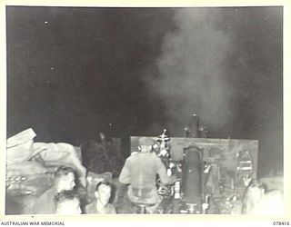 MOTUPINA POINT, BOUGAINVILLE ISLAND. 1945-01-18. PERSONNEL OF NO. 6 BATTERY, 2ND FIELD REGIMENT, FIRING THEIR LONG 25 POUNDERS AT THE UNIT GUN SITE NORTH OF THE TAVERA RIVER