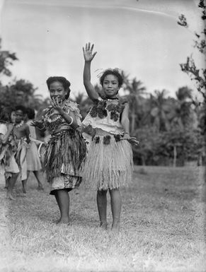 [Full-length portrait of two young Pacific Island girls]