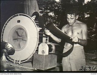 TOROKINA, BOUGAINVILLE ISLAND, SOLOMON ISLANDS. 1945-04-11. AFTER PROCESSING, THE FILM EXPOSED DURING A PHOTO RECONNAISSANCE MISSION BY A BOOMERANG AIRCRAFT OF NO. 5 (TACTICAL RECONNAISSANCE) ..