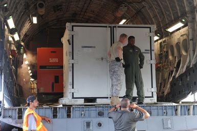 Earthquake ^ Tsunami - Pago Pago, American Samoa, October 2, 2009 -- FEMA generators await to be unloaded from a C-17 military cargo plane. FEMA shipped generators to American Samoa to restore power to American Samoa