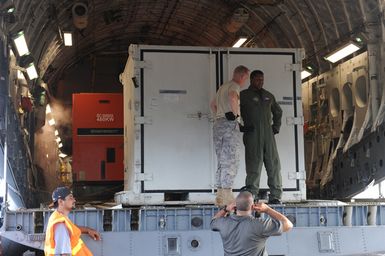 Earthquake ^ Tsunami - Pago Pago, American Samoa, October 2, 2009 -- FEMA generators await to be unloaded from a C-17 military cargo plane. FEMA shipped generators to American Samoa to restore power to American Samoa