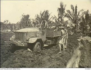 MOROTAI, HALMAHERA ISLANDS, NETHERLANDS EAST INDIES. C. 1945-01-24. MUD SEEMS TO BE SYNONYMOUS WITH THE TROPICS AND RAAF UNITS OPERATING IN THE HALMAHERAS ARE ENCOUNTERING THE SAME DIFFICULTIES AS ..