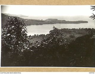 FINSCHHAFEN AREA, NEW GUINEA, 1943-10-25. FINSCHHAFEN AND THE HARBOUR. TO THE RIGHT OF THE PHOTOGRAPH IS SCARLET BEACH (NOT SHOWN), WHERE THE LANDING WAS MADE AND WHERE HEAVY FIGHTING TOOK PLACE