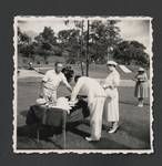 Colonel JK Murray and Evelyn Murray signing visitors book, Bomana War Cemetery, Port Moresby, c1950