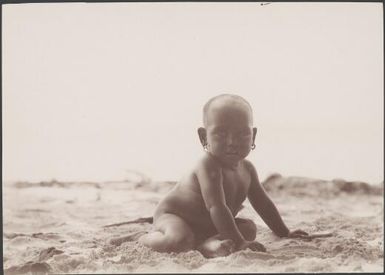 A baby on the beach at Gaeta, Solomon Islands, 1906 / J.W. Beattie