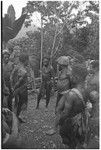 Dispute in Tuguma: men discuss garden damage done by a neighboring group's pig