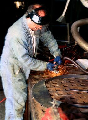 In Repair Shop 9 (R-9), grinding parts down smooth and clean help preserve the integrity of a ship