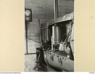 PORT MORESBY, PAPUA,, 1944-02-26. AN ENGINE DRIVING THE TRANSFER PUMP AT "A" TANK AT THE BULK OIL INSTALLATIONS OF THE 1ST PETROLEUM STORAGE COMPANY