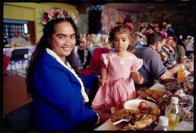 Alana (Kayne's auntie) and her daughter enjoy the feast at Kayne Lucas Upokokeu's hair-cutting ceremony