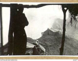 MCCULLOUCH'S RIDGE, NEW GUINEA. 1944-01-10. COMMANDING OFFICER'S TENT OF THE 2/9TH INFANTRY BATTALION ON THE RIDGE WREATHED IN MORNING MIST