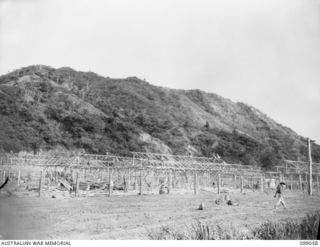 RABAUL, NEW BRITAIN. 1945-11-20. JAPANESE TROOPS BUILDING A BIG COMPOUND FOR SUSPECTED WAR CRIMINALS ON THE SITE OF THE OLD CIVILIAN GAOL