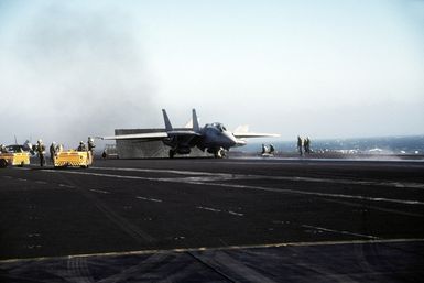 A Fighter Squadron 114 (VF-114) F-14A Tomcat aircraft stands by for launch aboard the nuclear-powered aircraft carrier USS Abraham Lincoln (CVN-72) during flight operations near Hawaii